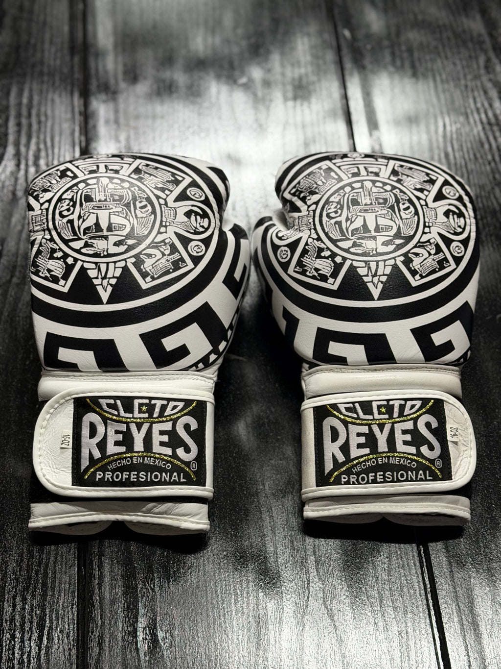 Cleto Reyes Professional boxing gloves in white featuring an intricate black Aztec calendar and tribal art design layout Back View