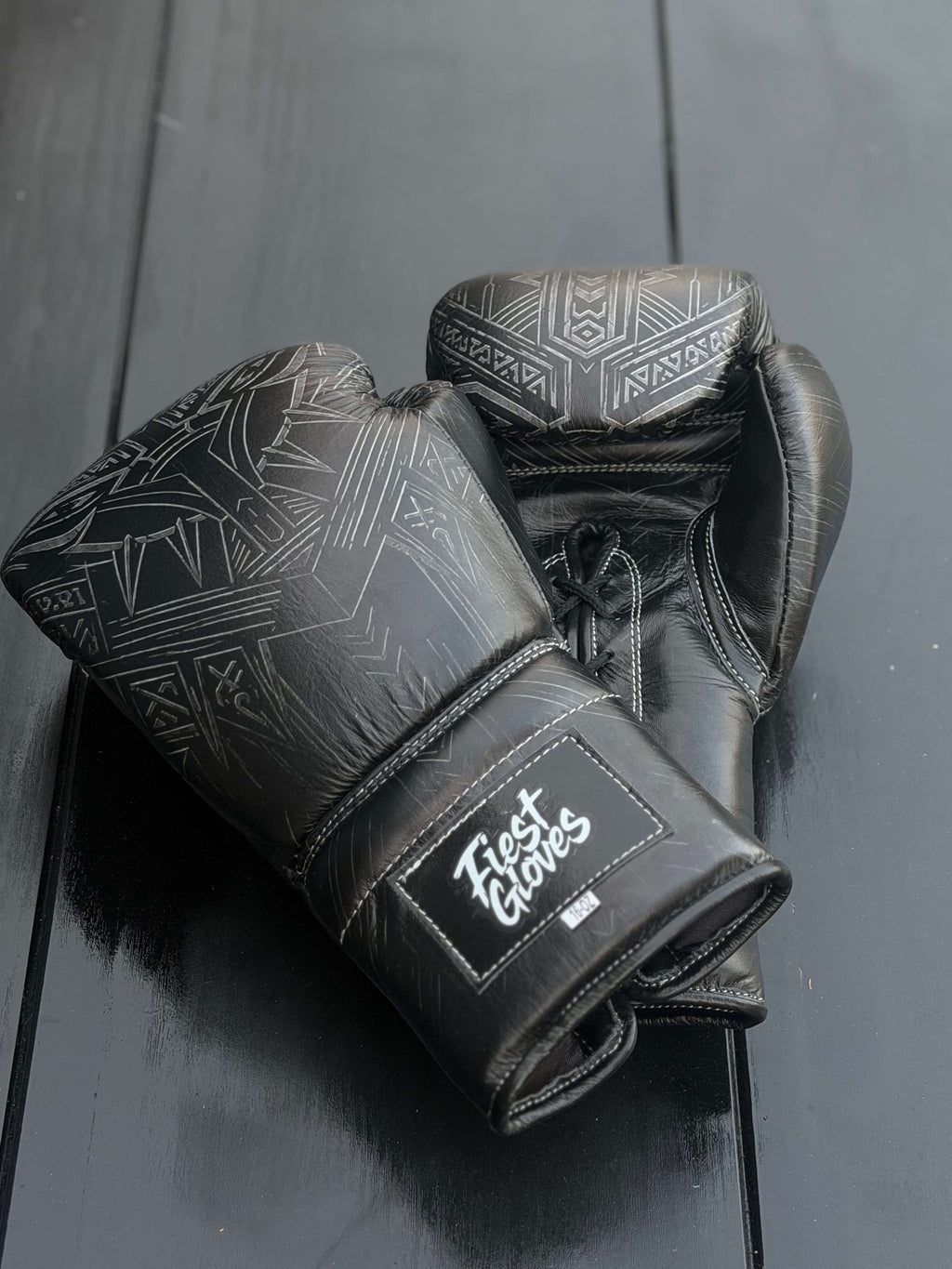 Fiest Panther Style Black Boxing Gloves - showing intricate panther print design and Fiest Gloves logo on the wrist strap.
