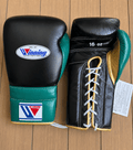 Winning Boxing Gloves Black/Green/Gold on Hands Training Action Shot