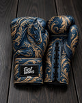 Blue leather boxing gloves with gold filigree and embossed horse design by Fiest Gloves.